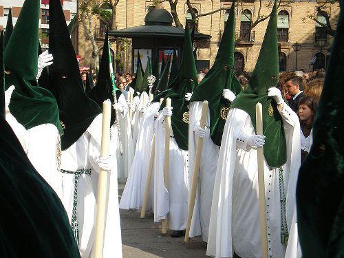Processions are preceded by 'nazarenos' with pointed hoods, Sevilla, Andalusia 