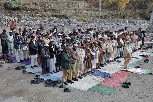 Praying Muslims in the northeastern province of Kunar