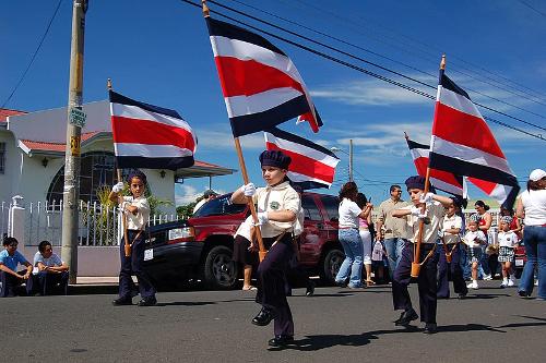 Girls wave flags of Costa Rica
