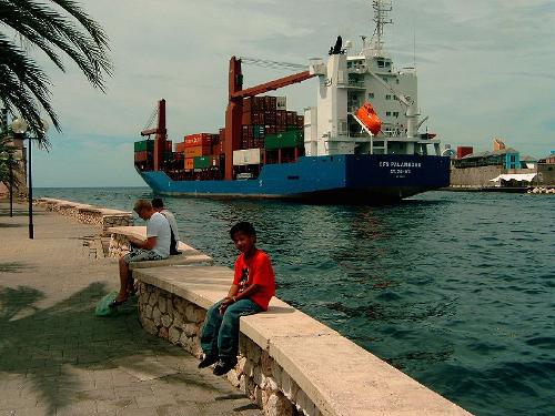 Container ship leaves the port of Curacao