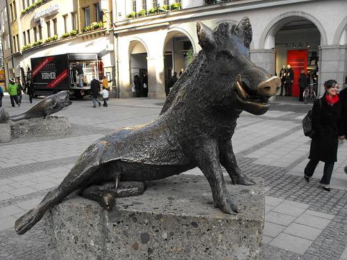 Statue of a wild boar in front of the Jagd- und Fischereimuseum in Munich, Germany