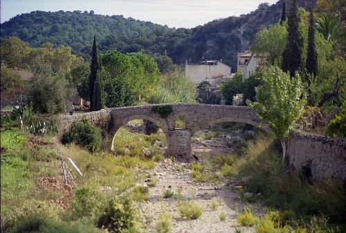 Old roman bridge which crosses a torrent surrounding Pollensa on Mallorca