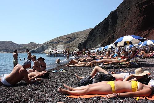 No golden or white beaches on Santorini