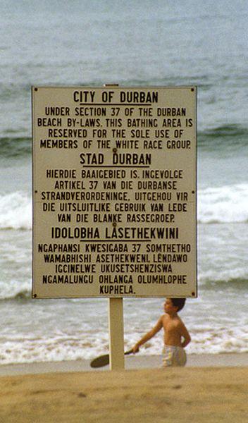 Sign at the beach with text in English, Afrikaans and Zulu
