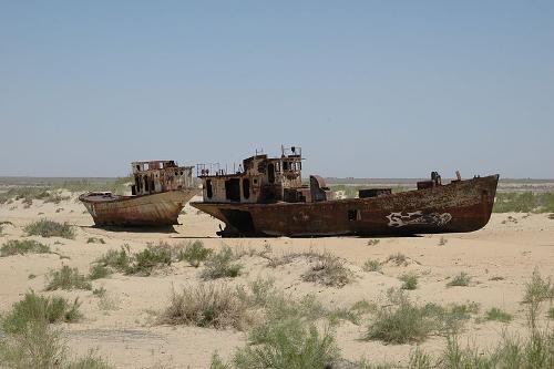 Boats on a dry stretch of Aral Sea, Uzbekistan